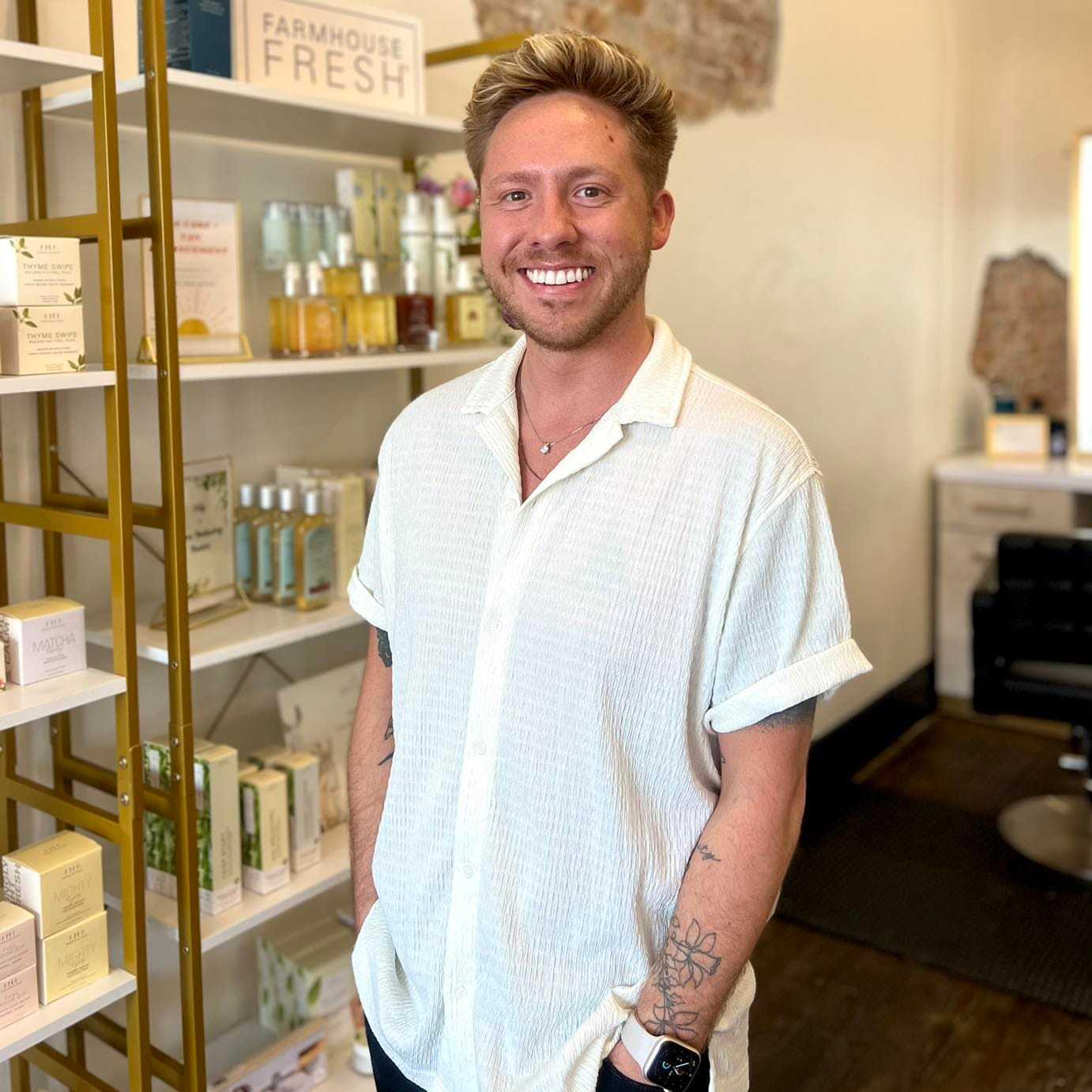 Portrait of Seth, a professional stylist at The 5th Parlour, showcasing their expertise and style.
