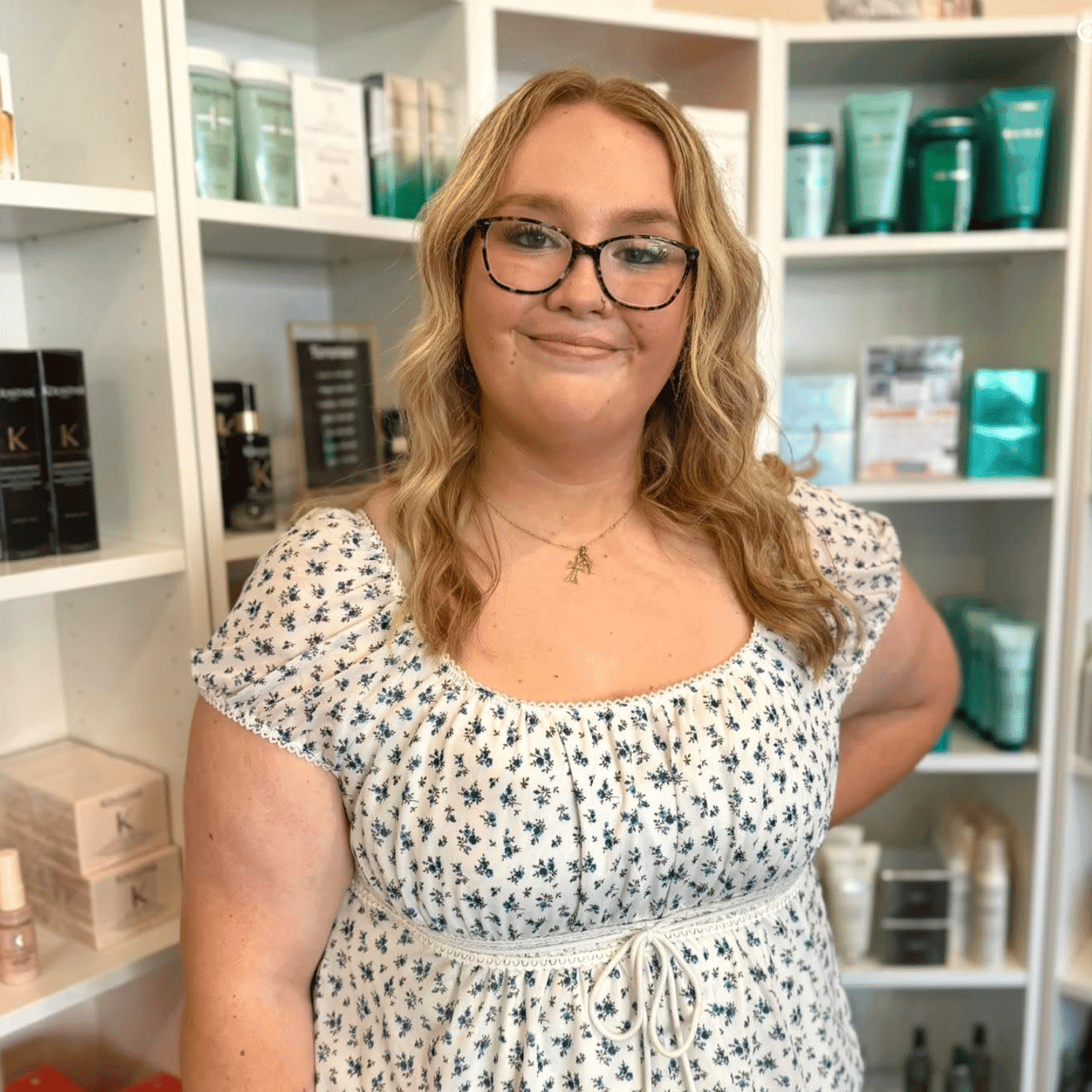 Portrait of Aubrey, a professional stylist at The 5th Parlour, showcasing their expertise and style.