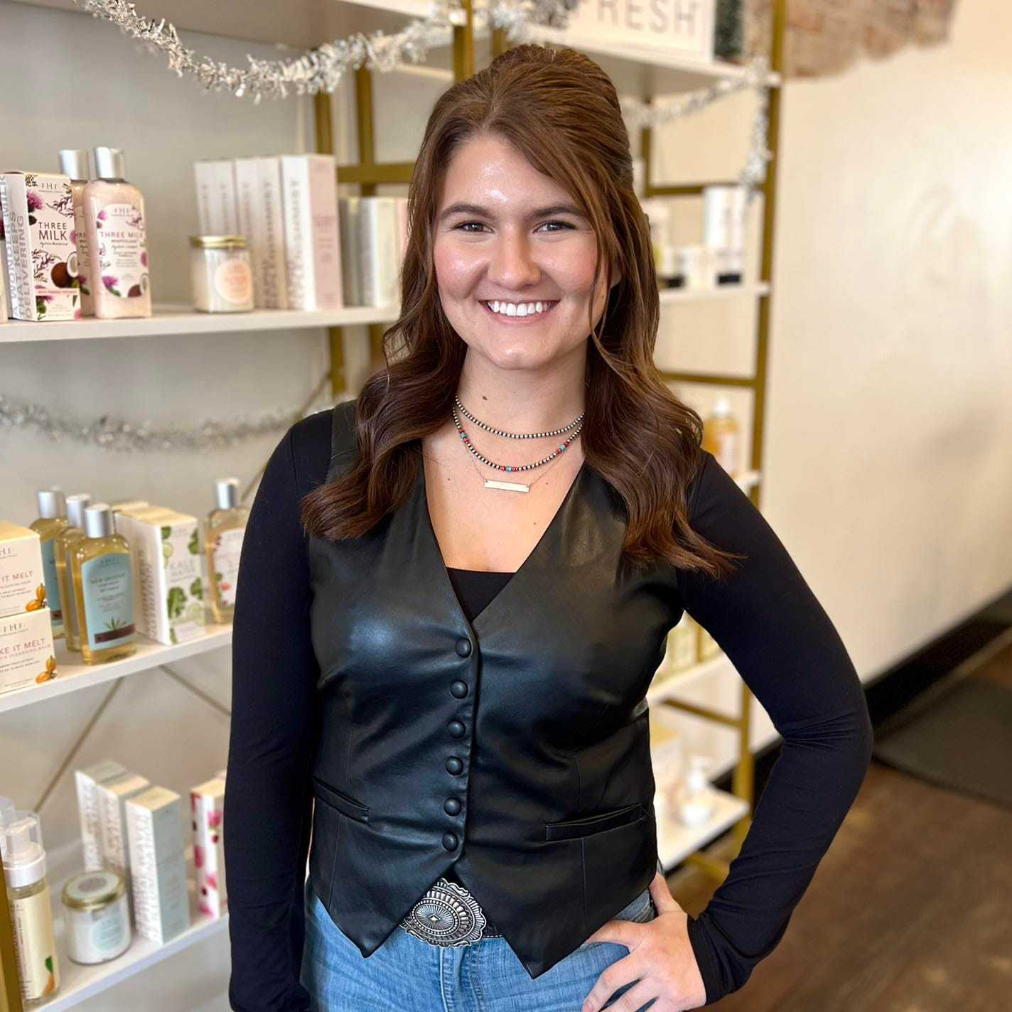 Portrait of Kesley, a professional stylist at The 5th Parlour, showcasing their expertise and style.