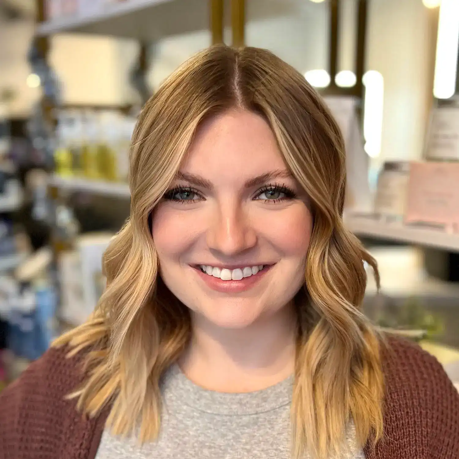 Portrait of Madison, a professional stylist at The 5th Parlour, showcasing their expertise and style.