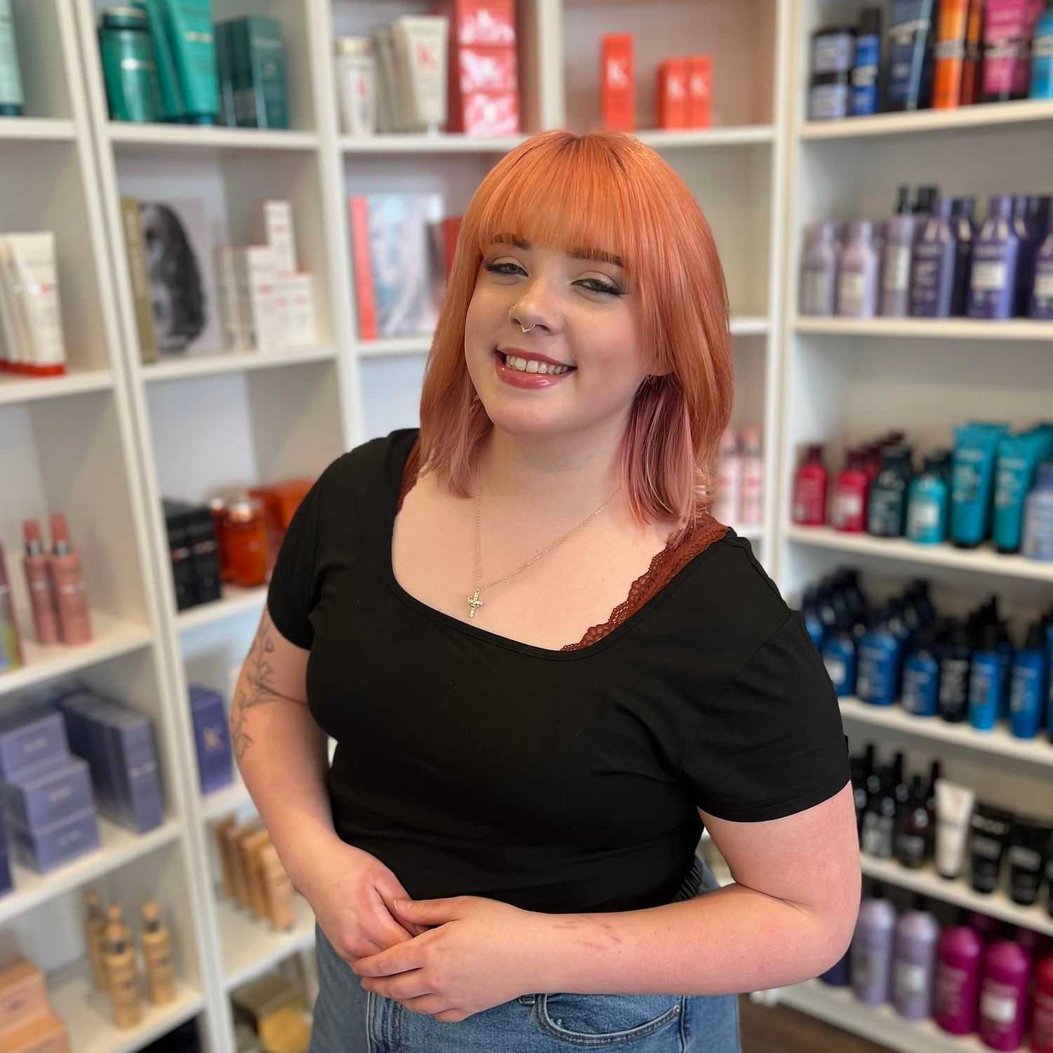 Portrait of Zoe, a professional stylist at The 5th Parlour, showcasing their expertise and style.