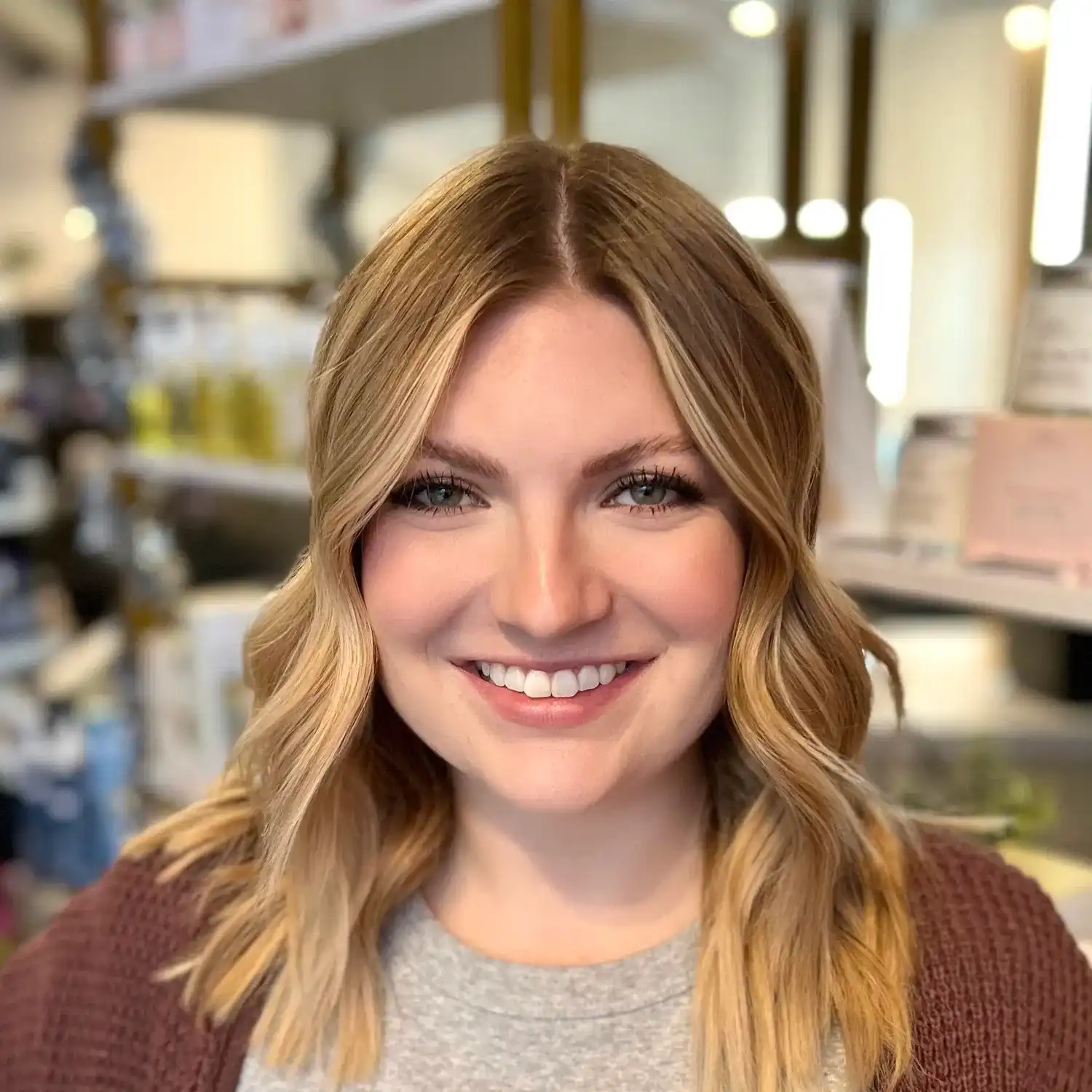 Portrait of Madison, a professional stylist at The 5th Parlour, showcasing their expertise and style.