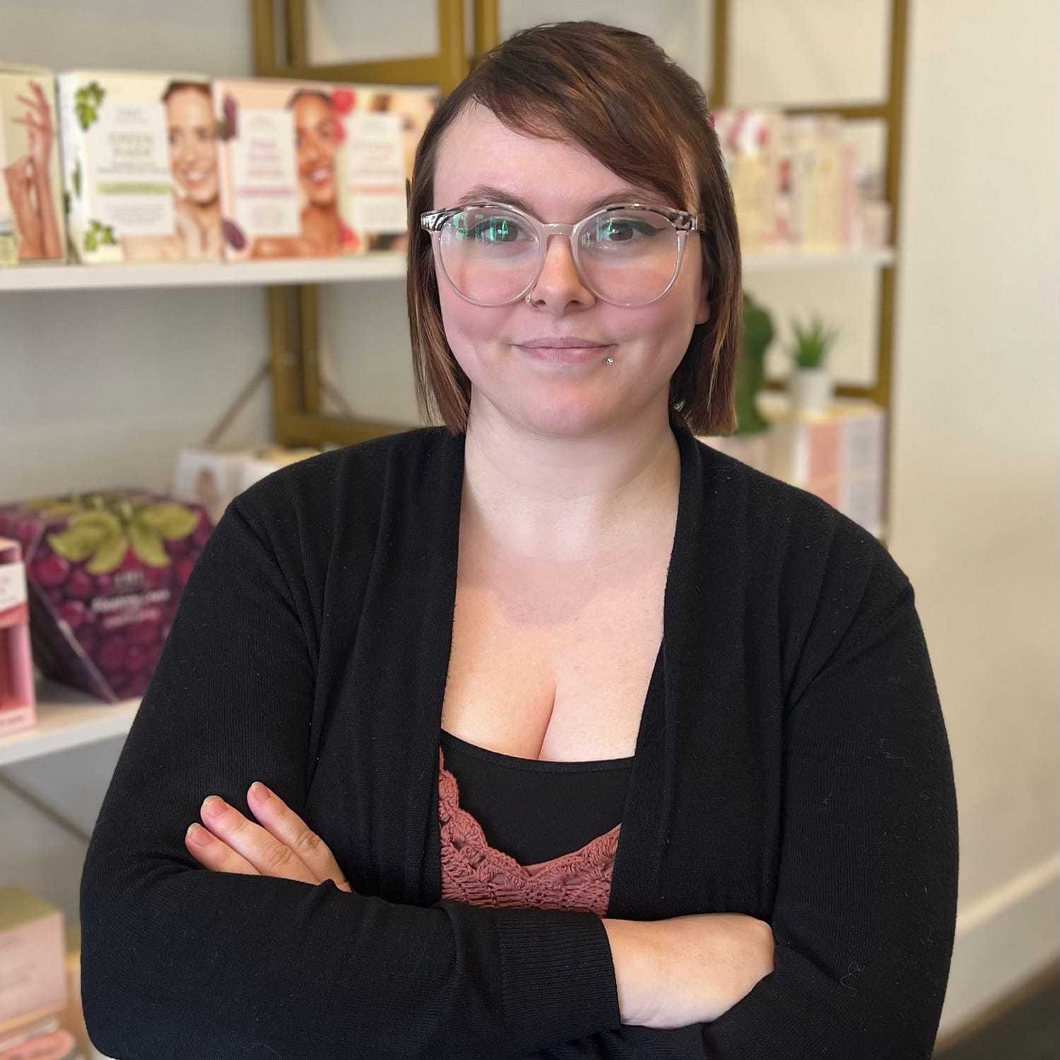 Portrait of Alli, a professional stylist at The 5th Parlour, showcasing their expertise and style.